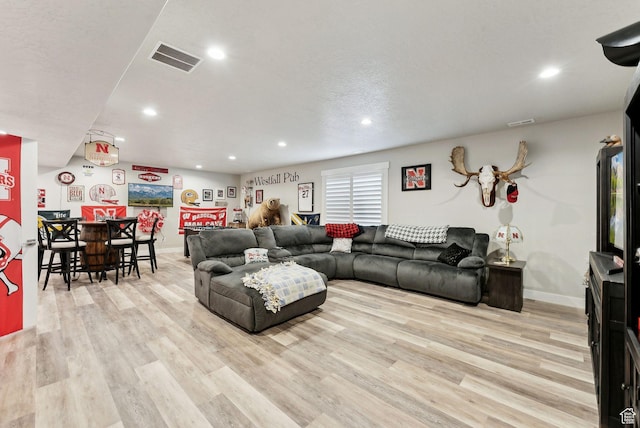 6593 W Bonnie Jean Ln Unit 13, Herriman, UT 84096 - living room with light wood finished floors, recessed lighting, visible vents, and baseboards