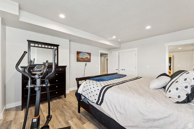 6593 W Bonnie Jean Ln Unit 13, Herriman, UT 84096 - bedroom featuring baseboards, recessed lighting, and light wood finished floors