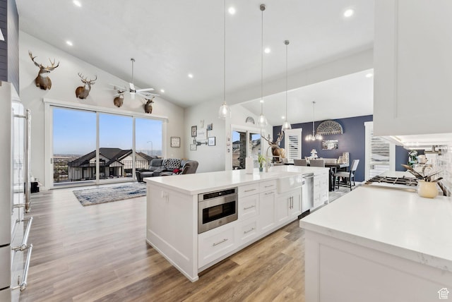 6593 W Bonnie Jean Ln Unit 13, Herriman, UT 84096 - kitchen with light wood-style flooring, white cabinets, open floor plan, dishwasher, and recessed lighting