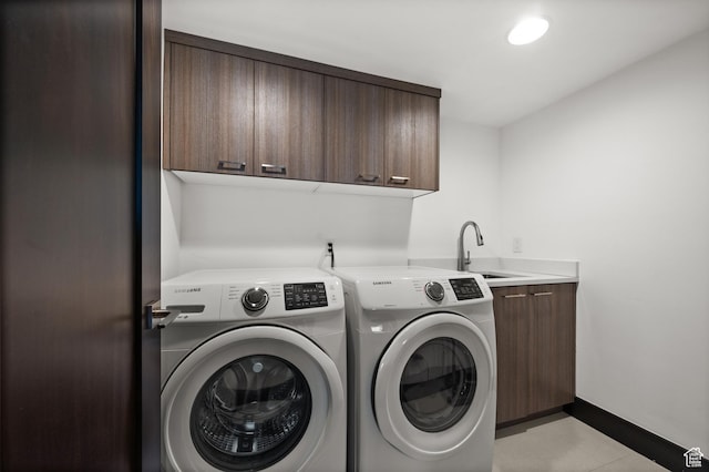 88 King Rd, Park City, UT 84060 - washroom featuring a sink, baseboards, washing machine and dryer, and cabinet space