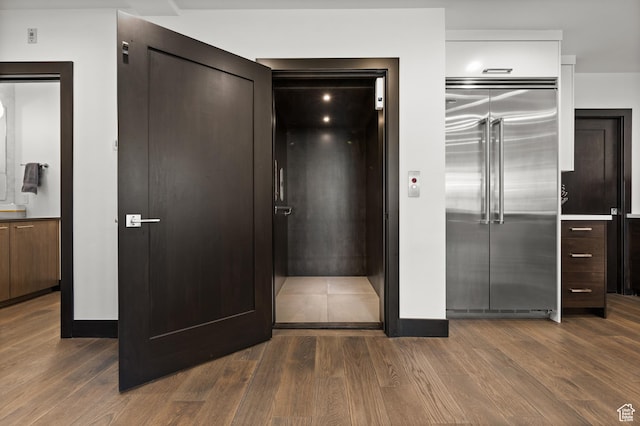88 King Rd, Park City, UT 84060 - unfurnished bedroom with built in refrigerator, elevator, and dark wood-type flooring