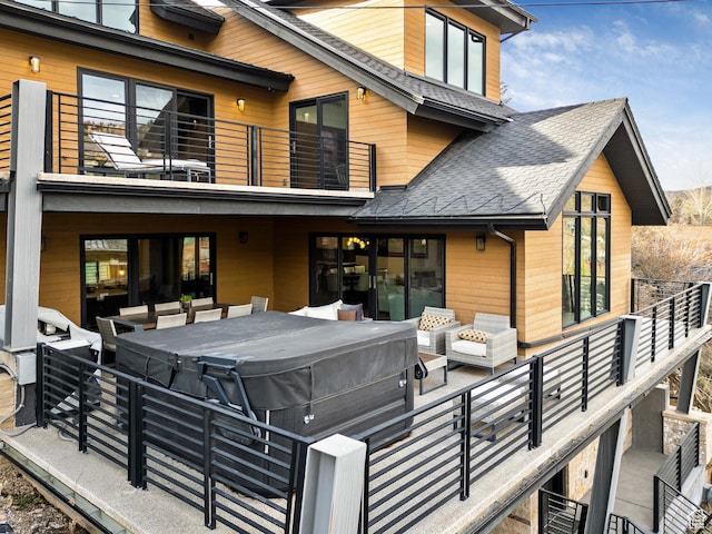 88 King Rd, Park City, UT 84060 - rear view of property featuring roof with shingles, a hot tub, outdoor lounge area, and a balcony