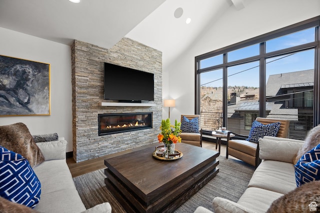 88 King Rd, Park City, UT 84060 - living area featuring a stone fireplace, recessed lighting, wood finished floors, and high vaulted ceiling