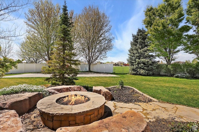 1380 Angel Crest Way, Kaysville, UT 84037 - view of yard featuring a patio, a fire pit, and a fenced backyard