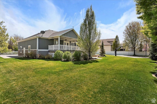1380 Angel Crest Way, Kaysville, UT 84037 - rear view of property with fence, board and batten siding, and a lawn