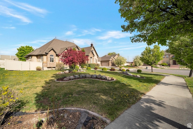 10252 S 3570 W, South Jordan, UT 84095 - view of property exterior with fence, stucco siding, and a lawn