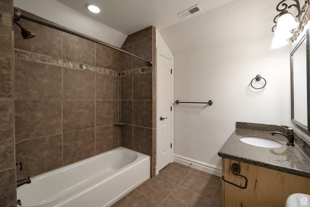 10252 S 3570 W, South Jordan, UT 84095 - bathroom featuring visible vents, vaulted ceiling, tile patterned floors, shower / washtub combination, and vanity