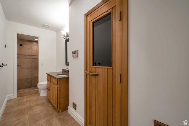 10252 S 3570 W, South Jordan, UT 84095 - full bathroom featuring a tile shower, tile patterned flooring, toilet, vanity, and baseboards