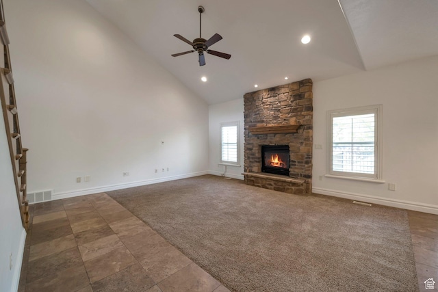 10252 S 3570 W, South Jordan, UT 84095 - unfurnished living room featuring high vaulted ceiling, a ceiling fan, visible vents, a stone fireplace, and carpet