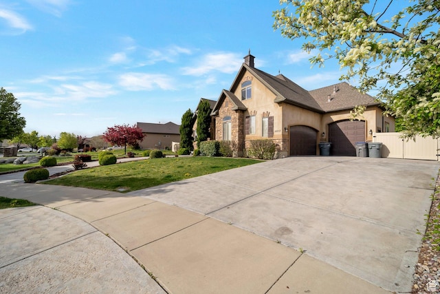 10252 S 3570 W, South Jordan, UT 84095 - french country style house with stucco siding, a garage, driveway, stone siding, and a front yard