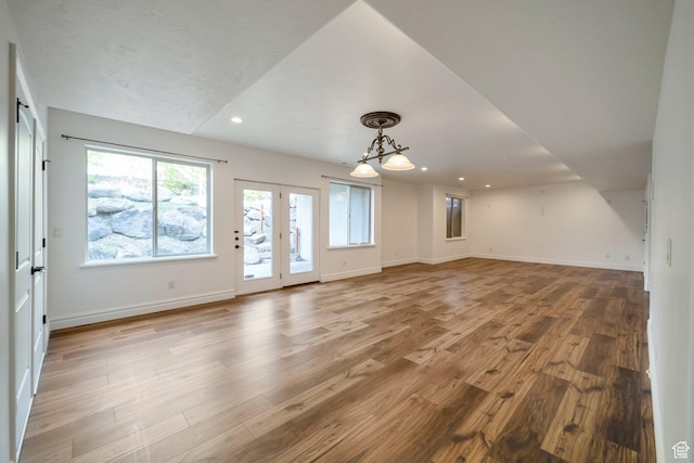 10252 S 3570 W, South Jordan, UT 84095 - unfurnished living room featuring wood finished floors, recessed lighting, a chandelier, and baseboards