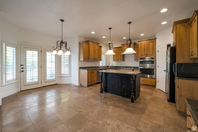10252 S 3570 W, South Jordan, UT 84095 - kitchen with a center island, brown cabinets, appliances with stainless steel finishes, and baseboards