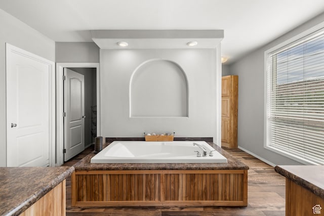 4147 S Spanish Valley Dr, Moab, UT 84532 - bathroom featuring wood finished floors, a garden tub, recessed lighting, and baseboards