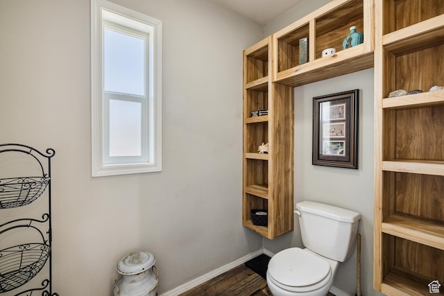 4147 S Spanish Valley Dr, Moab, UT 84532 - bathroom with wood finished floors, a healthy amount of sunlight, toilet, and baseboards