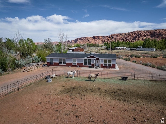 4147 S Spanish Valley Dr, Moab, UT 84532 - single story home featuring a mountain view, a rural view, and fence private yard