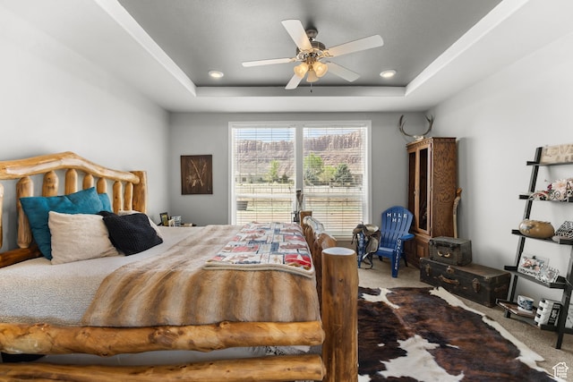 4147 S Spanish Valley Dr, Moab, UT 84532 - bedroom featuring a raised ceiling, a ceiling fan, and carpet flooring