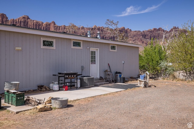 4147 S Spanish Valley Dr, Moab, UT 84532 - back of property featuring a patio area, a mountain view, and central AC