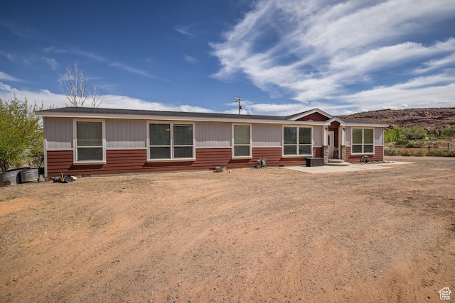 4147 S Spanish Valley Dr, Moab, UT 84532 - back of house featuring a patio and central air condition unit
