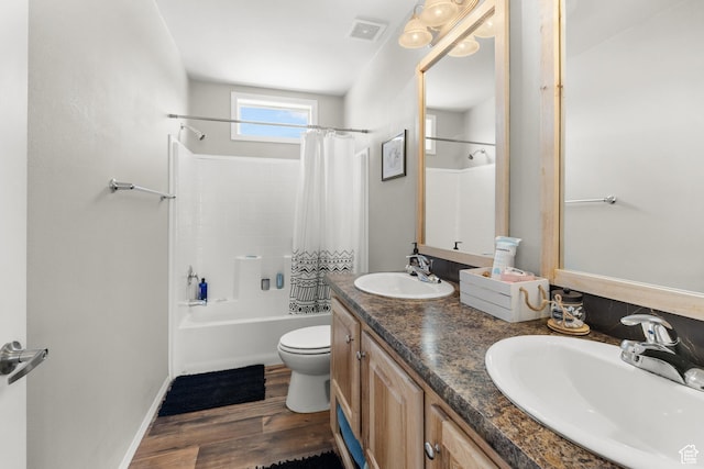 4147 S Spanish Valley Dr, Moab, UT 84532 - full bathroom with toilet, a sink, wood finished floors, and visible vents
