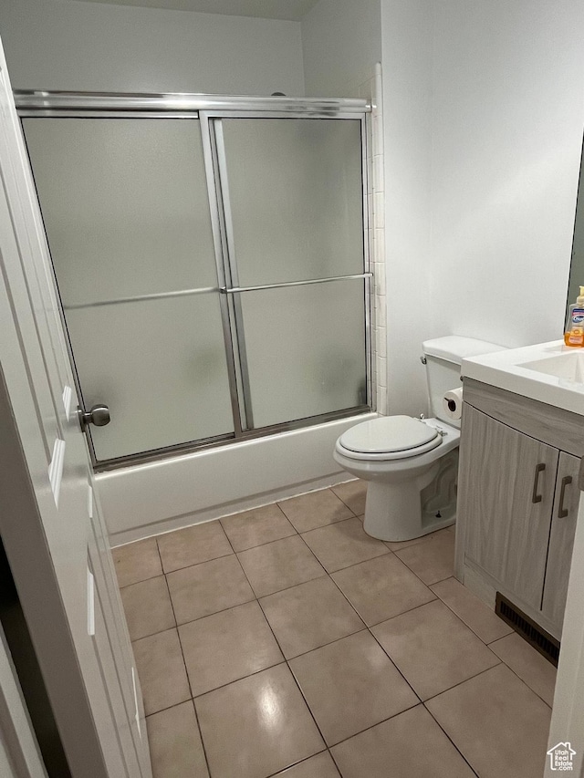 4616 S 3720 W, West Valley City, UT 84120 - full bathroom featuring shower / bath combination with glass door, tile patterned flooring, vanity, toilet, and visible vents