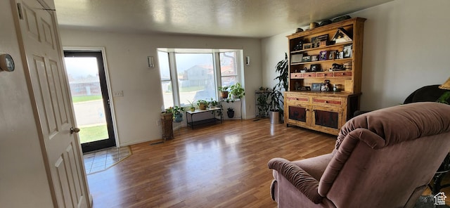 4616 S 3720 W, West Valley City, UT 84120 - living area with a textured ceiling, plenty of natural light, baseboards, and wood finished floors
