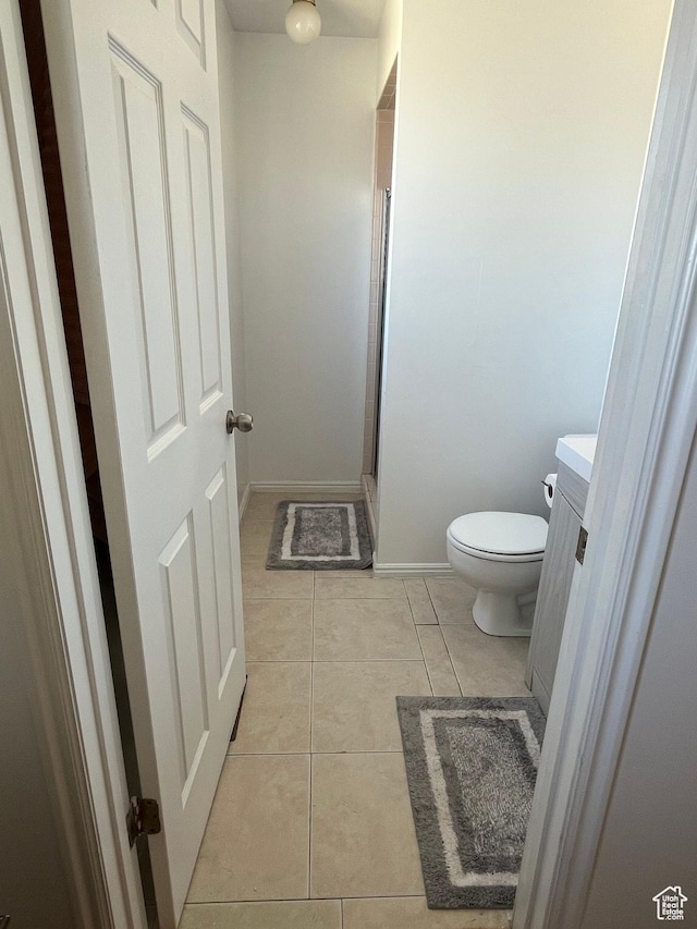 4616 S 3720 W, West Valley City, UT 84120 - bathroom with vanity, toilet, baseboards, tile patterned floors, and a stall shower