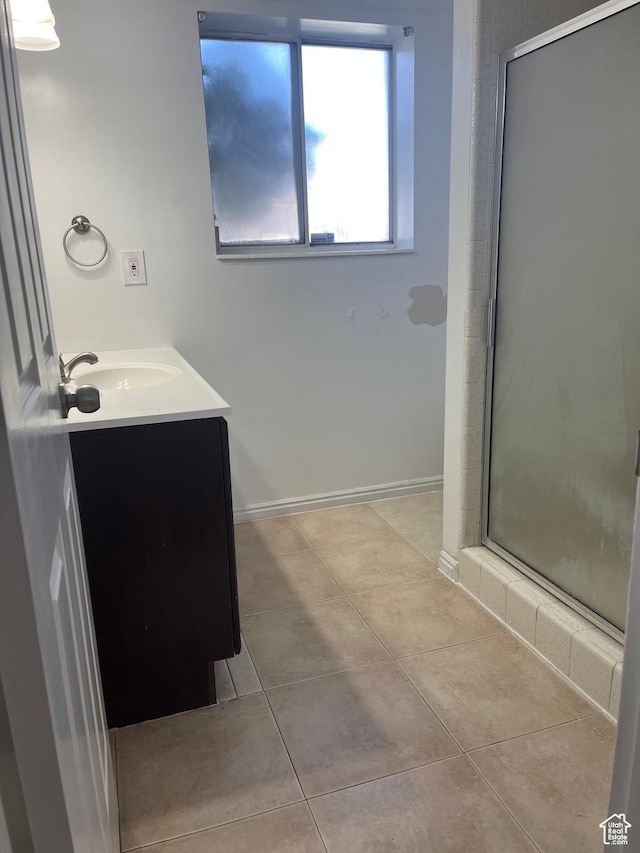 4616 S 3720 W, West Valley City, UT 84120 - full bath featuring vanity, tile patterned flooring, baseboards, and a stall shower