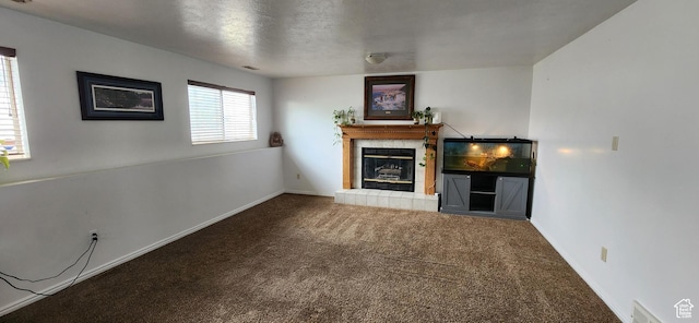 4616 S 3720 W, West Valley City, UT 84120 - unfurnished living room with a tiled fireplace, baseboards, carpet flooring, and visible vents