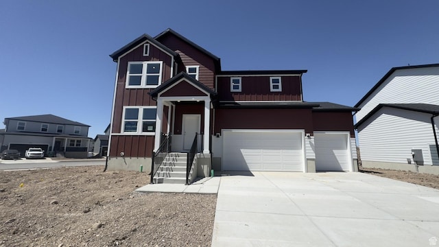 3467 S 3100 W Unit 176, West Haven, UT 84401 - view of front of home featuring board and batten siding, driveway, and an attached garage