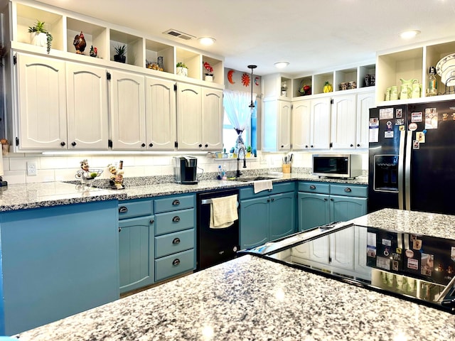 225 S 1400 W, Vernal, UT 84078 - kitchen with stainless steel microwave, open shelves, a sink, dishwasher, and refrigerator with ice dispenser