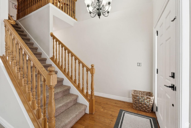 53 W 300 S, Midway, UT 84049 - staircase featuring wood-type flooring, a chandelier, and baseboards