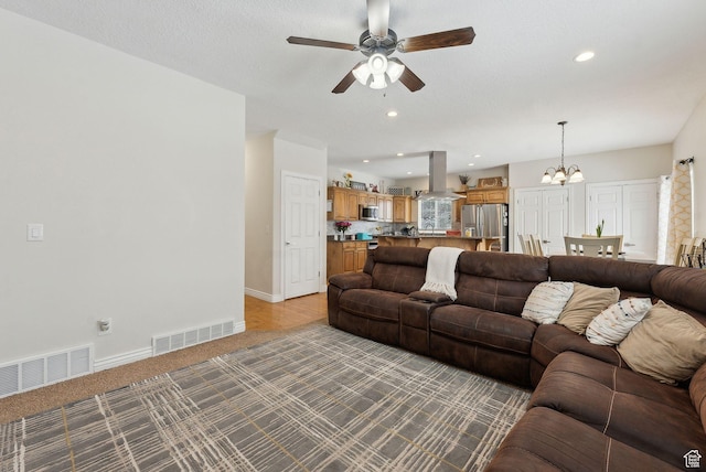 53 W 300 S, Midway, UT 84049 - living area with visible vents, baseboards, light carpet, and ceiling fan with notable chandelier