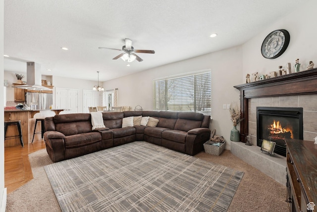 53 W 300 S, Midway, UT 84049 - living area with carpet floors, a fireplace, recessed lighting, and ceiling fan with notable chandelier