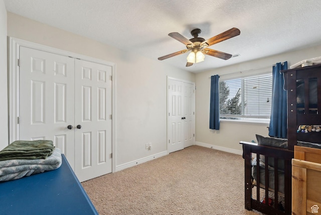 53 W 300 S, Midway, UT 84049 - carpeted bedroom with baseboards, a ceiling fan, a textured ceiling, and two closets