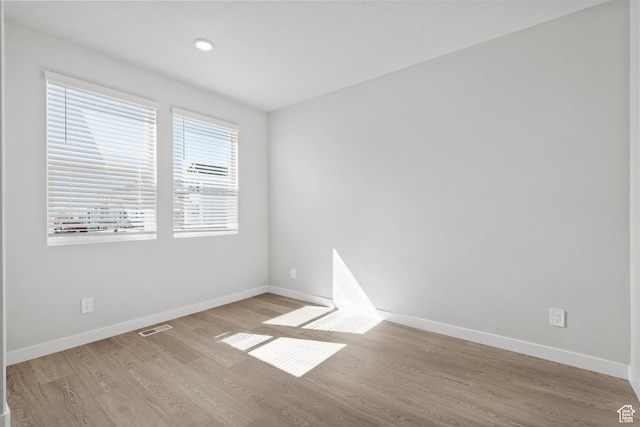 3452 S 3100 W Unit 152, West Haven, UT 84401 - empty room with visible vents, baseboards, and wood finished floors