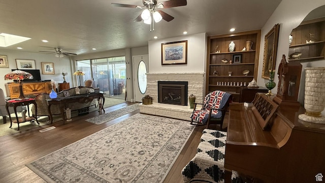 379 W 400 N Unit 7, Bountiful, UT 84010 - living room with recessed lighting, wood finished floors, a ceiling fan, and a fireplace
