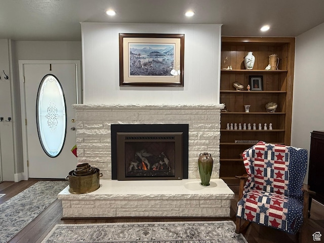 379 W 400 N Unit 7, Bountiful, UT 84010 - living area with wood finished floors, a fireplace with raised hearth, and recessed lighting