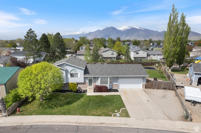 2627 E 1680 S, Spanish Fork, UT 84660 - tri-level home with a front yard, a residential view, a mountain view, driveway, and an attached garage