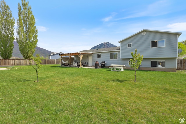 2627 E 1680 S, Spanish Fork, UT 84660 - back of property featuring a pergola, a patio, a yard, a fenced backyard, and a mountain view