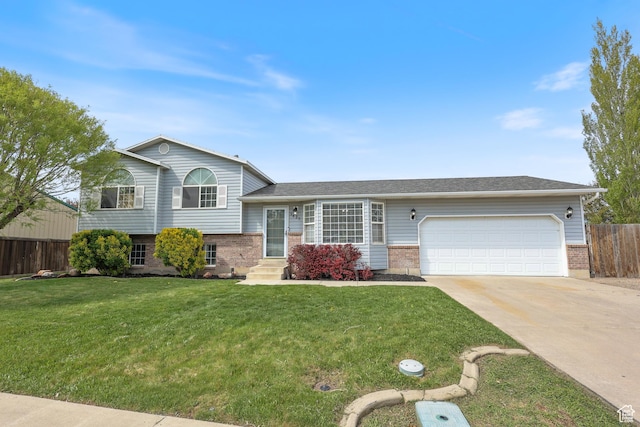 split level home with fence, concrete driveway, brick siding, and a garage