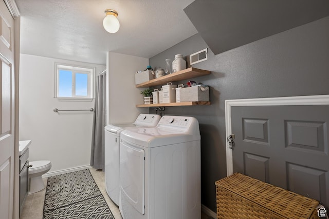 2627 E 1680 S, Spanish Fork, UT 84660 - laundry room with light tile patterned floors, independent washer and dryer, visible vents, baseboards, and laundry area