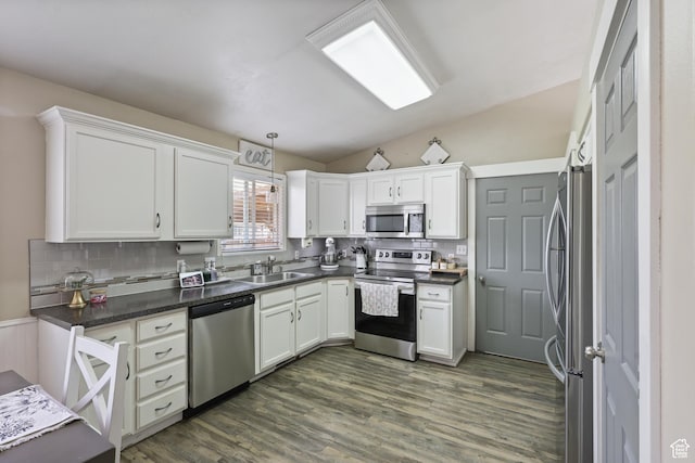 2627 E 1680 S, Spanish Fork, UT 84660 - kitchen featuring appliances with stainless steel finishes, white cabinets, backsplash, a sink, and dark wood-type flooring