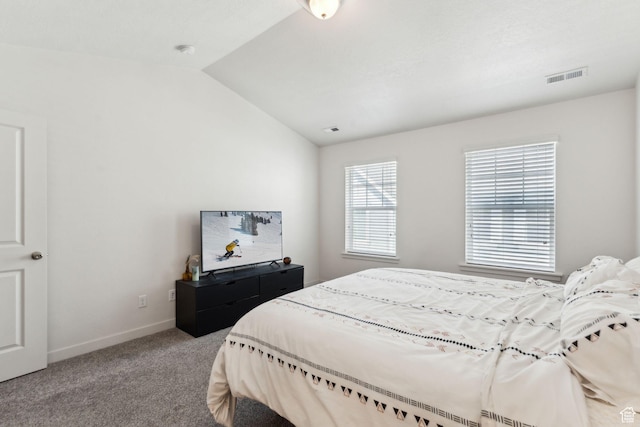 bedroom featuring carpet flooring, baseboards, visible vents, and lofted ceiling