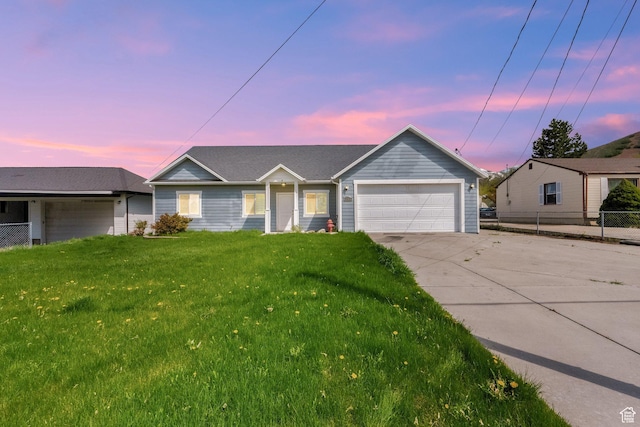 ranch-style house with a garage, fence, a front yard, and concrete driveway