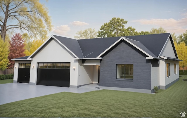 view of front of house with concrete driveway, brick siding, a front lawn, and a garage