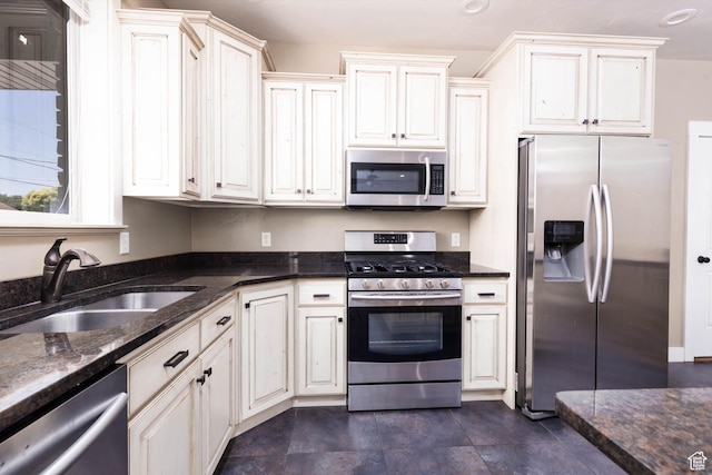 167 E 300 S, Salina, UT 84654 - kitchen featuring appliances with stainless steel finishes, a sink, and dark stone countertops