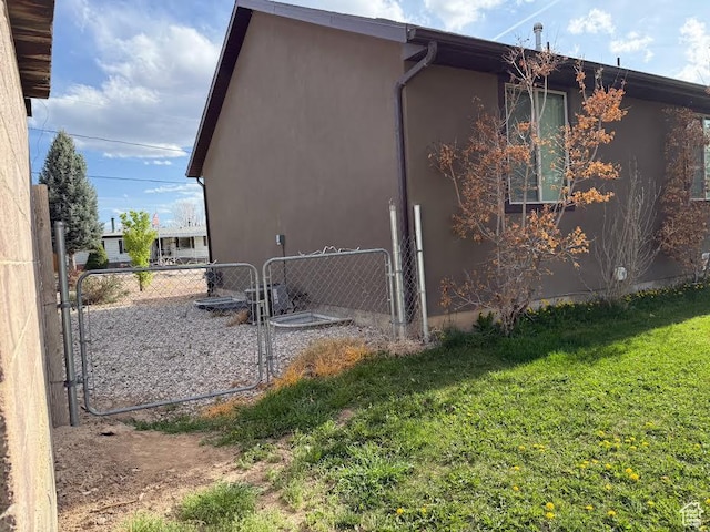 167 E 300 S, Salina, UT 84654 - view of side of home with stucco siding and a gate