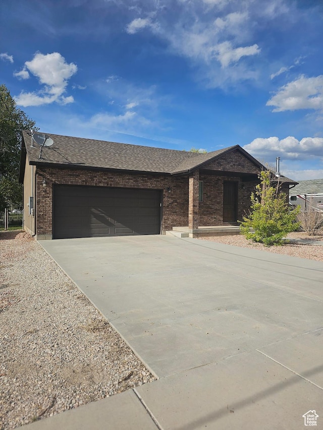 167 E 300 S, Salina, UT 84654 - ranch-style home featuring driveway, a garage, brick siding, and roof with shingles
