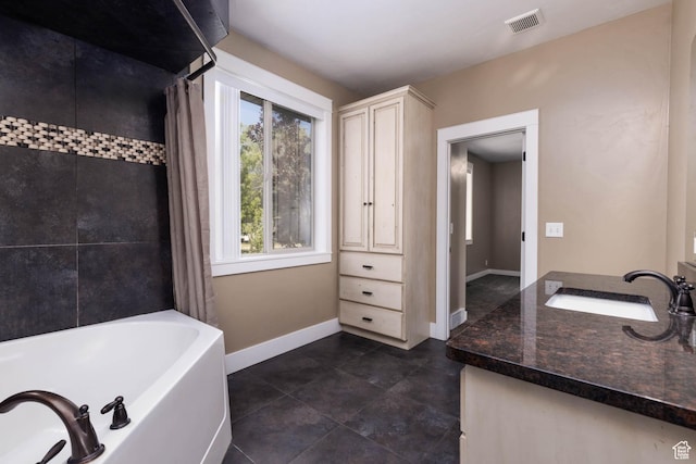 167 E 300 S, Salina, UT 84654 - bathroom featuring vanity, baseboards, tile patterned floors, and shower / bath combo with shower curtain