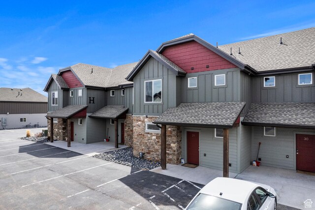 140 W 150 S Unit H29, Garden City, UT 84028 - craftsman house featuring uncovered parking, stone siding, a shingled roof, and board and batten siding